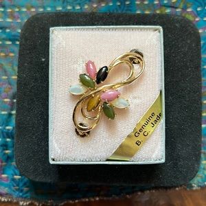 B.C. gold tone jade brooch